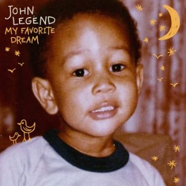 Cover of John Legend's children's album, "My Favorite Dream," features a photo of him as a boy with yellow drawings of stars and the moon and birds.
