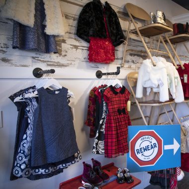 Girls toddler clothing hanging on a wall